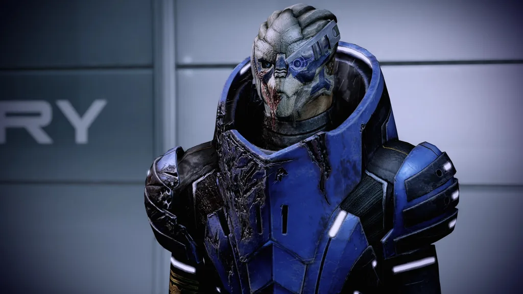 Close-up of the turian squadmate Garrus Vakarian in battle-worn blue armour in Mass Effect Legendary Edition