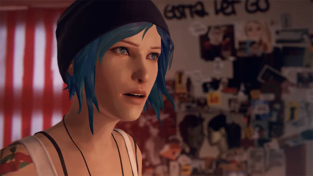 Close-up of Chloe Price, a young woman with blue hair and a beanie, in a cluttered bedroom, from Life is Strange Remastered.